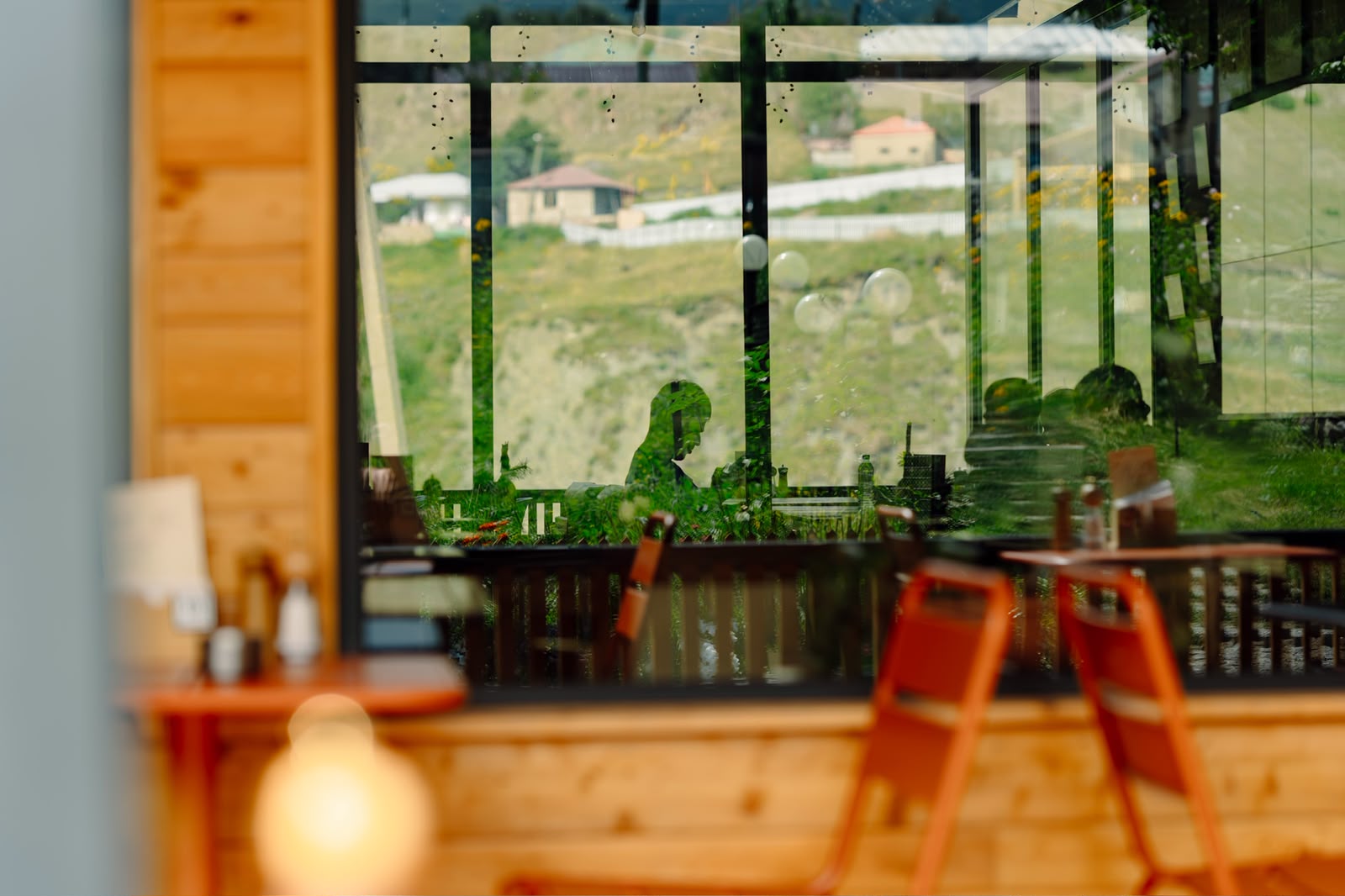 Mountain view reflected in Samani's dining room windows