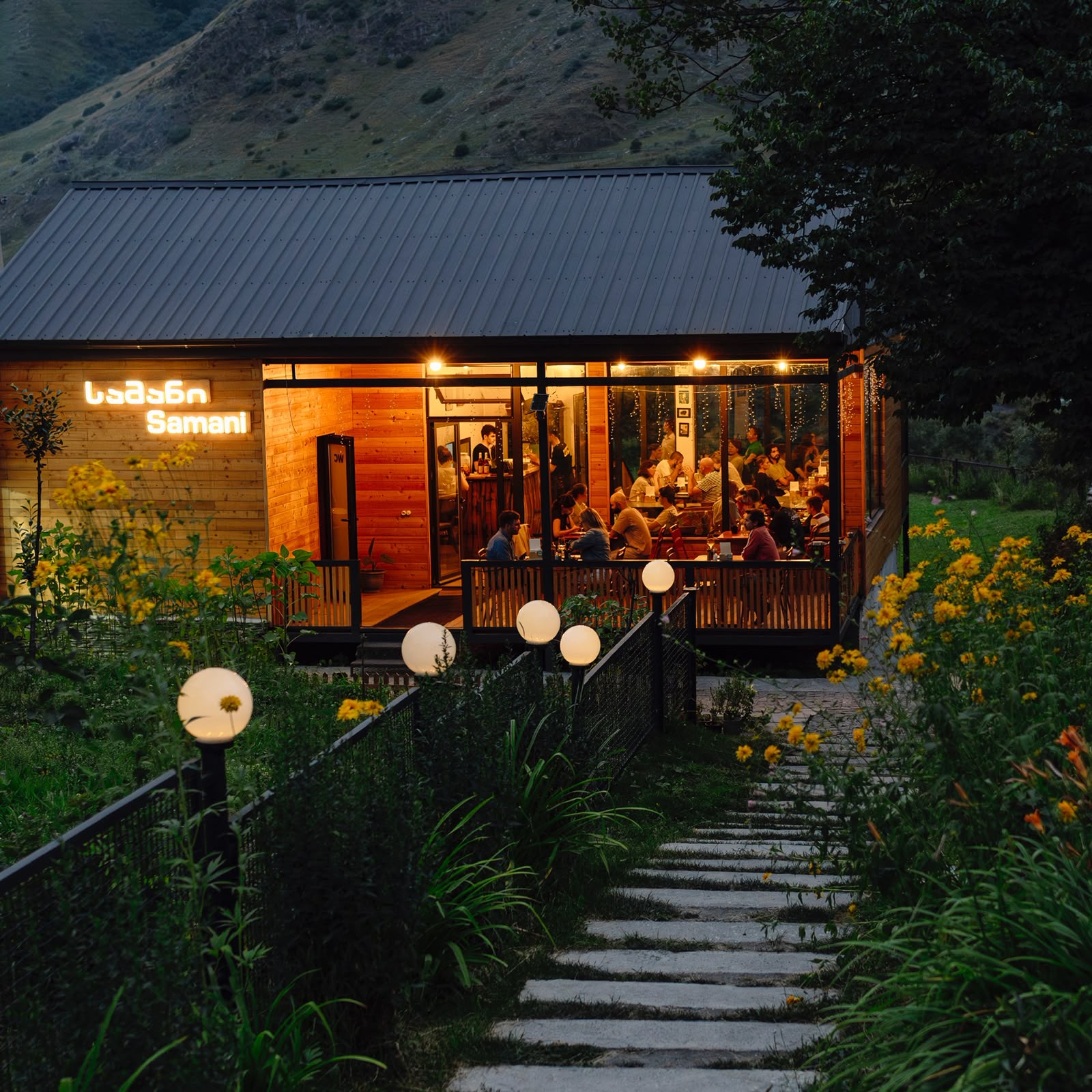 Samani Restaurant glowing warmly at dusk